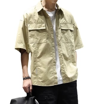 Férfi ing lazább szabású, rövid ujjú, hegyes gallér, zsebes díszítés, egyszínű