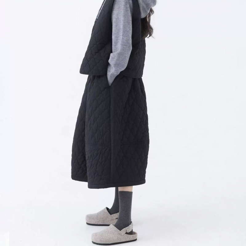 Pamučna Bud suknja, jednofarbna, srednje duljine, šavovi splicing, jesen-zima kolekcija 2025, elegantan gradski stil