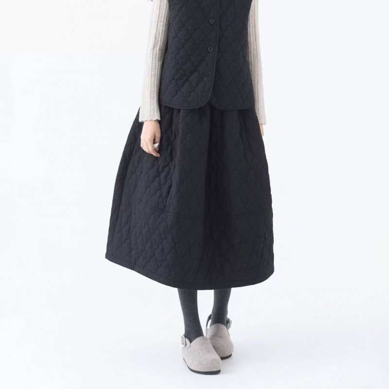 Pamučna Bud suknja, jednofarbna, srednje duljine, šavovi splicing, jesen-zima kolekcija 2025, elegantan gradski stil