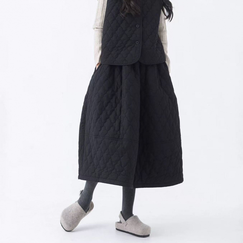 Pamučna Bud suknja, jednofarbna, srednje duljine, šavovi splicing, jesen-zima kolekcija 2025, elegantan gradski stil