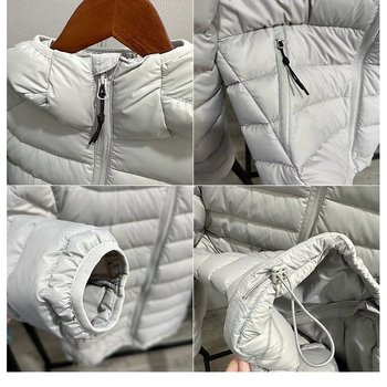 Jakna s kapuljačom, punjenje od bijelog patkina perja 85–90%, vanjski najlonski materijal, uski kroj, srednja duljina 50–65 cm