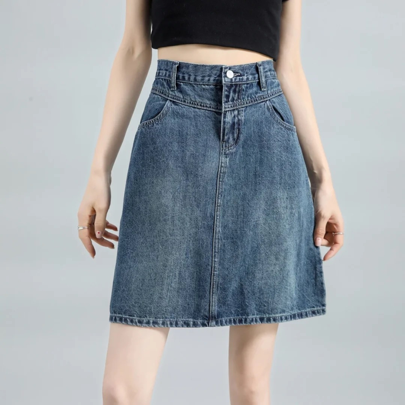 Τζιν φούστα - ψηλή μέση, γραμμή Α, μέσο μήκος, βαμβάκι 50–70%, καλοκαίρι 2025