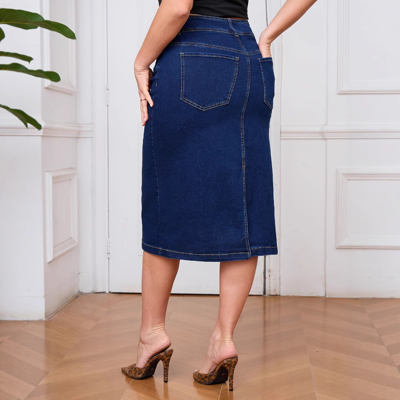 Ženska denim suknja kroja olovke, pamuk–elastan smjesa (80–90% pamuka), srednja duljina, visoka elastičnost, ljeto 2025