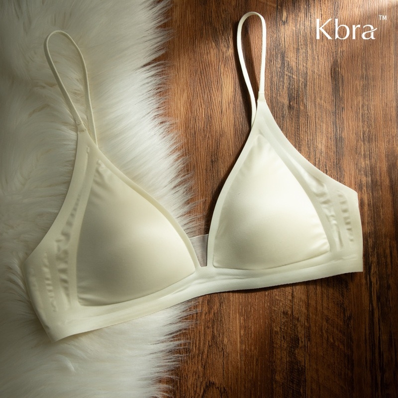 Bevielė trikampio formos liemenėlė iš pieno satino nailono, gilus V formos iškirptė, plonos petnešėlės, be siūlių, plonas formuojamas kaušelis