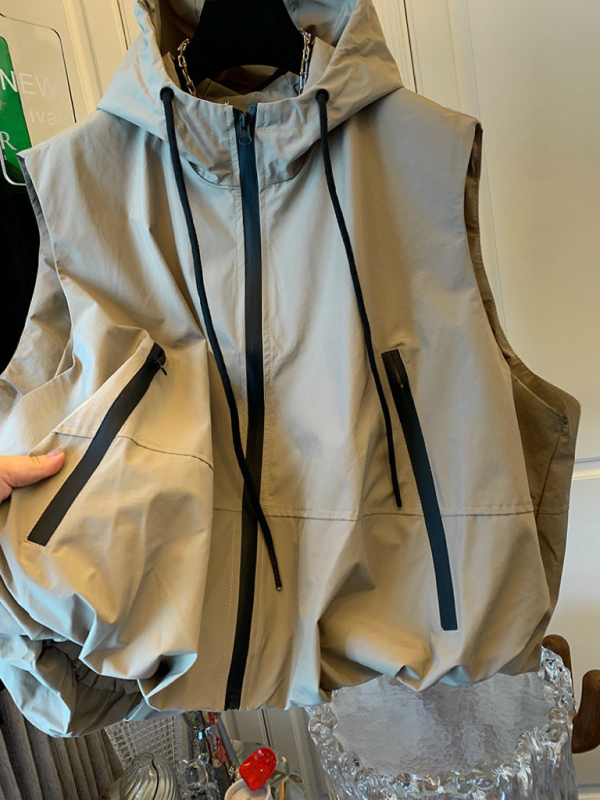 Ženski bezrukavni vest s stojećim ovratnikom, kratka duljina 40–50 cm, poliester, prednji zatvarač