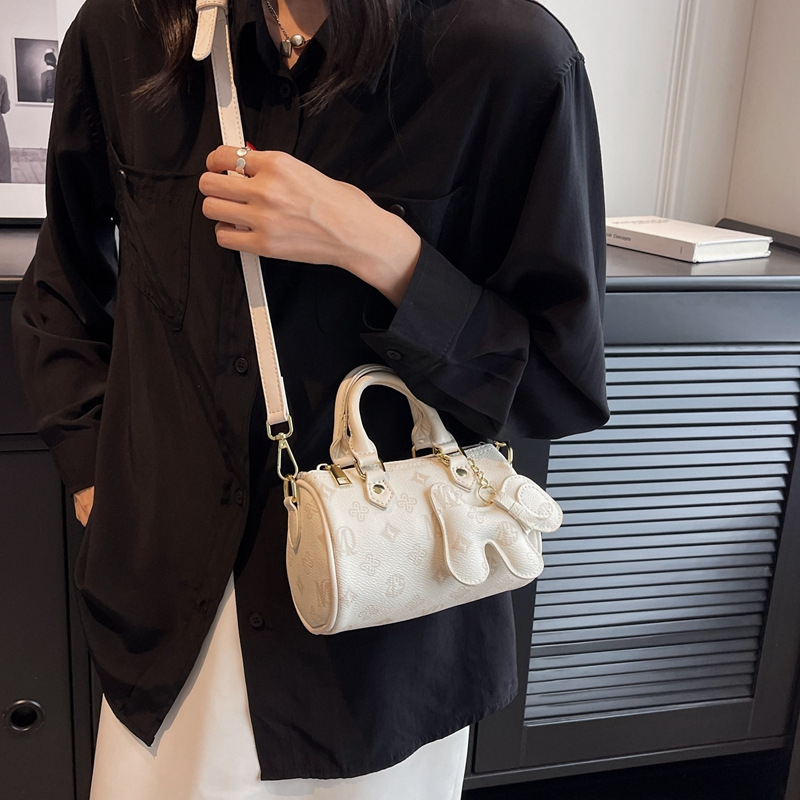 Crossbody taška cylindrického tvaru z PU, zips, vrecko na telefón, street style