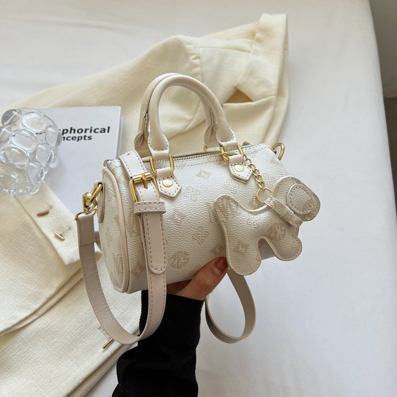 Crossbody taška cylindrického tvaru z PU, zips, vrecko na telefón, street style