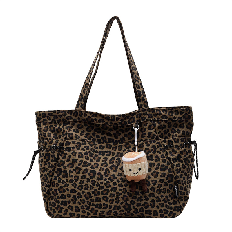 Geantă tote din pânză cu imprimeu leopard, închidere cu fermoar, căptușeală poliester, buzunar ascuns cu fermoar, siluetă orizontală tridimensională.