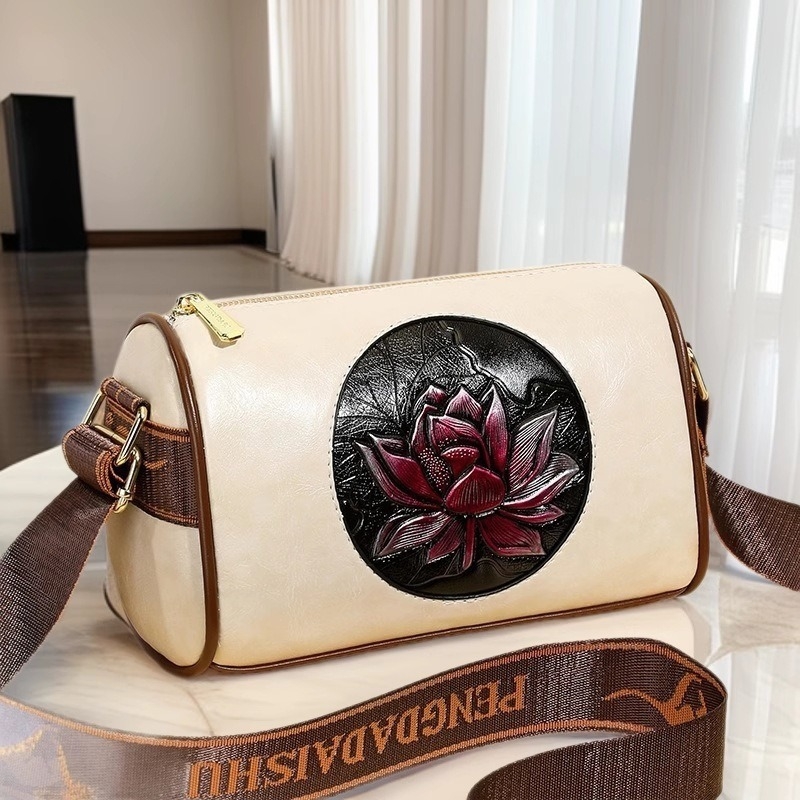 Ženska torbica preko ramena crossbody – cilindričnog oblika, PU materijal, zatvaranje na zip, unutarnji džep sa zipom