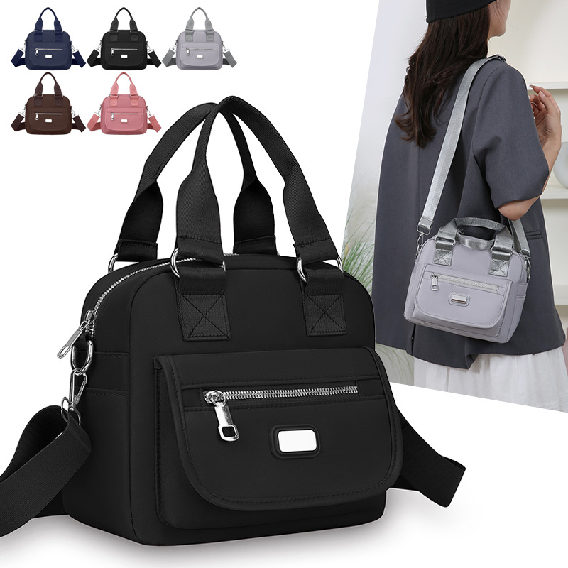 Ženska crossbody torba od Oxford tkanine, horizontalni kvadratni oblik, zatvaranje na zip, unutarnja džep s zipom, jedna naramenica