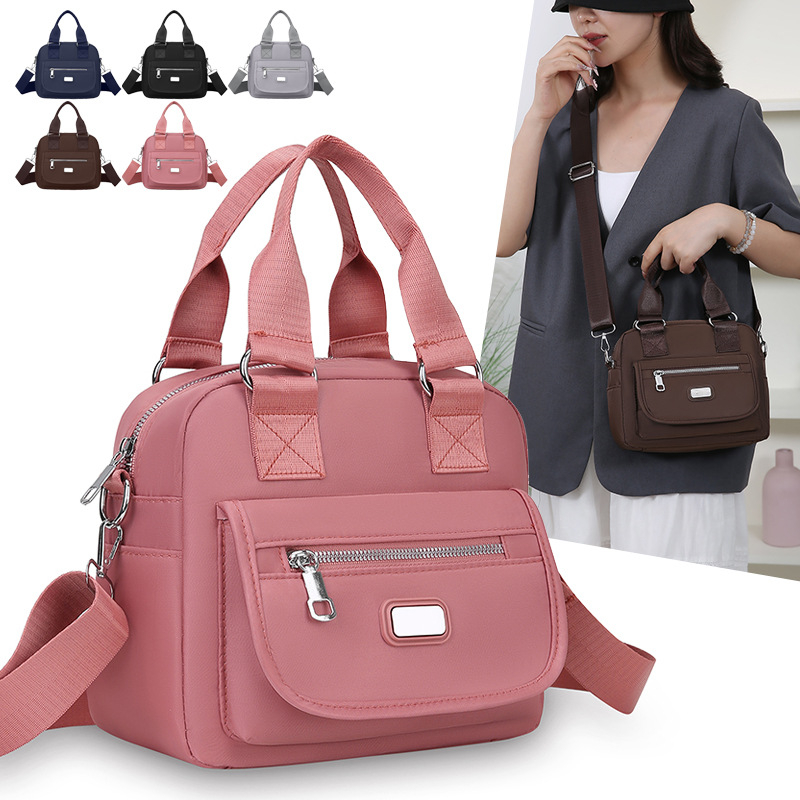 Ženska crossbody torba od Oxford tkanine, horizontalni kvadratni oblik, zatvaranje na zip, unutarnja džep s zipom, jedna naramenica