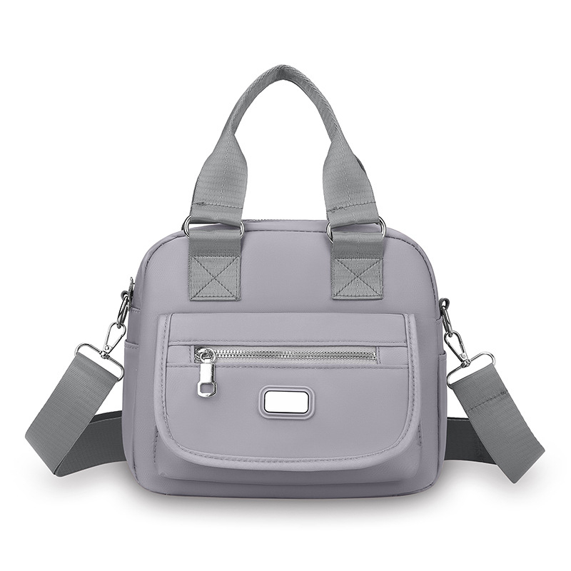 Ženska crossbody torba od Oxford tkanine, horizontalni kvadratni oblik, zatvaranje na zip, unutarnja džep s zipom, jedna naramenica