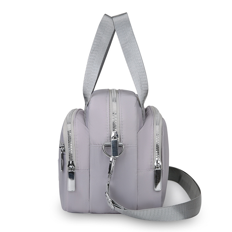 Ženska torbica preko ramena, kvadratnog oblika od Oxford tkanine, zatvarač, unutarnja organizacija: džep za telefon i laminirani džep sa zatvaračem, podstava Oxford