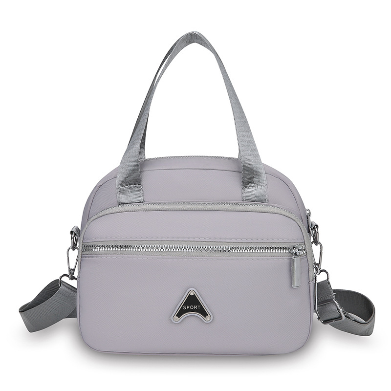 Ženska torbica preko ramena, kvadratnog oblika od Oxford tkanine, zatvarač, unutarnja organizacija: džep za telefon i laminirani džep sa zatvaračem, podstava Oxford