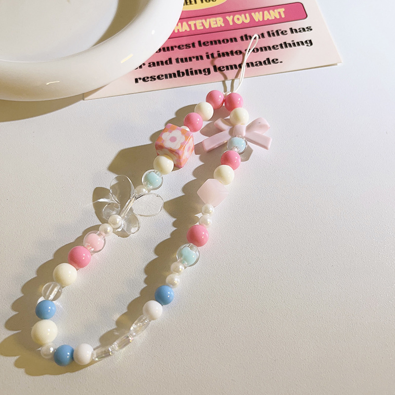 Șnur pentru telefon cu lanț de mărgele, șnur din nailon, pandantiv cu personaj de desene animate și cataramă din plastic.