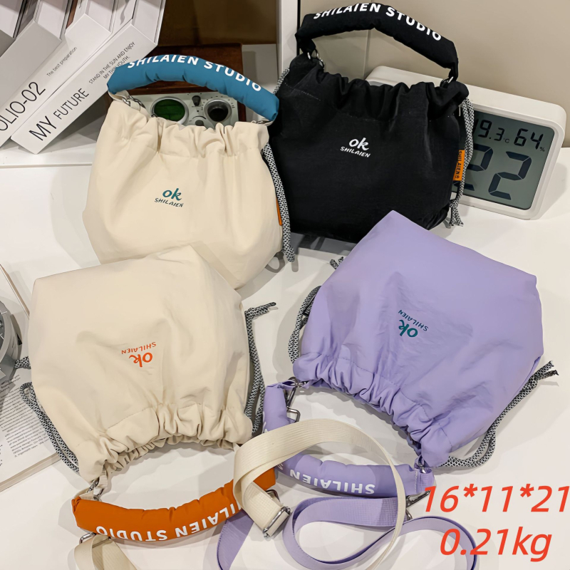 Torba za kamere za mirrorless i DSLR – vanjski dio od najlona, podstava od poliestera, velika zapremina, zakrivljeni ramenski pojas, unisex