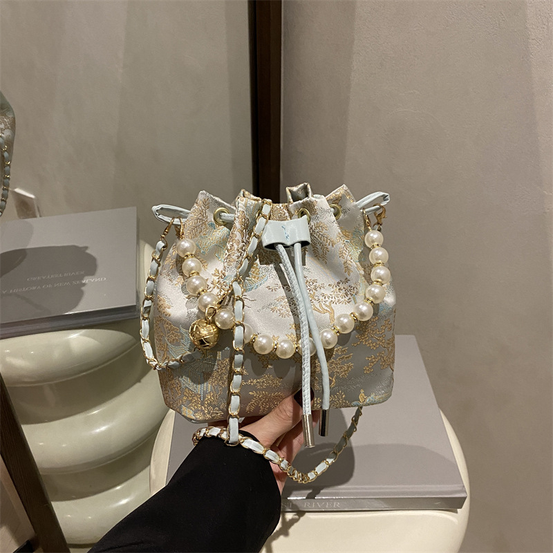 Dámska taška vedro s mestským minimalizmom, PU materiál, naťahovací uzáver, vnútorná priehradka na telefón