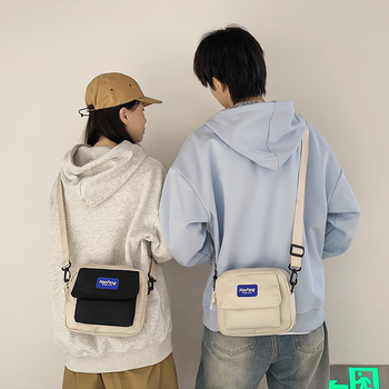 Nappali crossbody táska Oxford anyagból, hengeres forma, cipzáras nyitás, belső nylon bélés