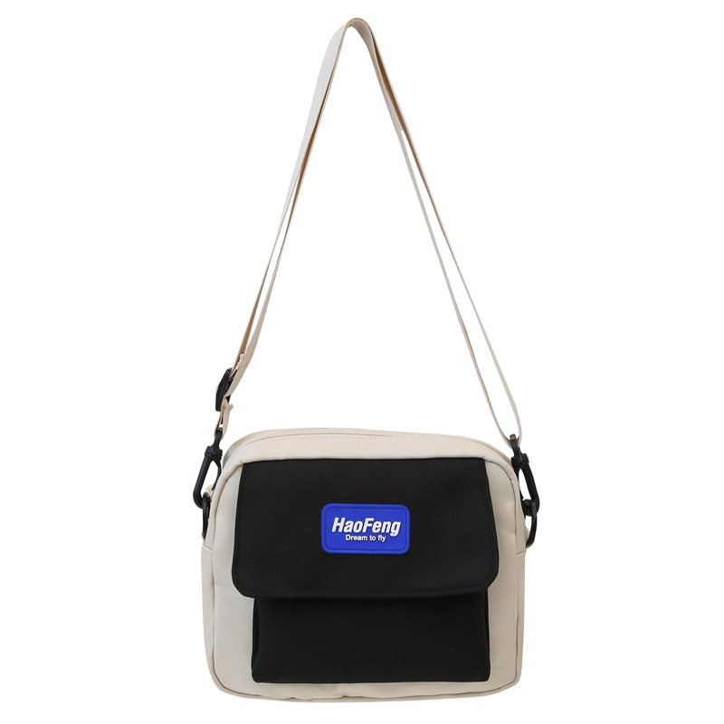 Nappali crossbody táska Oxford anyagból, hengeres forma, cipzáras nyitás, belső nylon bélés
