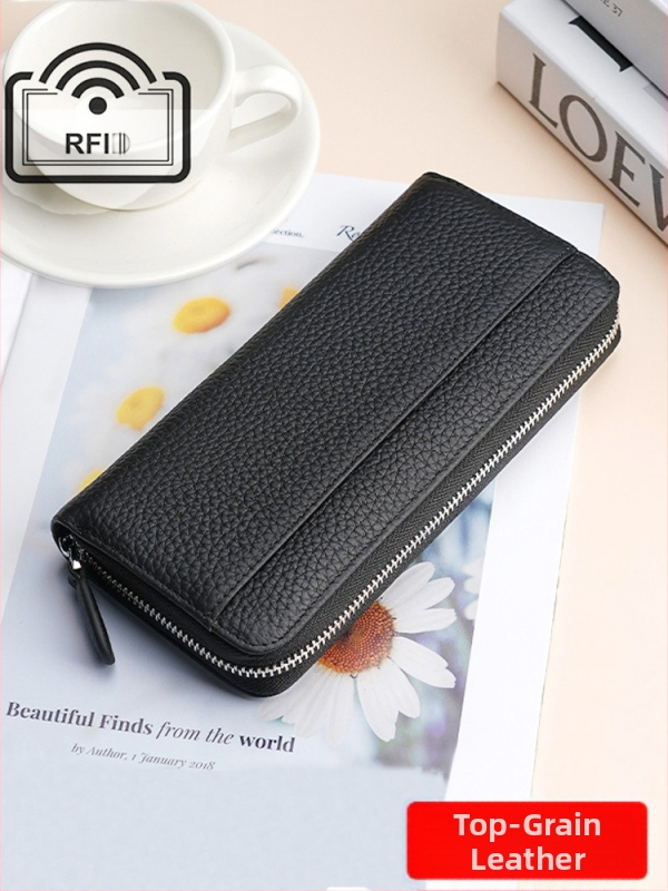 Naistele ehtne nahast pikk klutch-kott, tõmblukuga, vertikaalne ruudu kujuline siluett, kõrgekvaliteediline veiseloha nahk, tõmblukuga suletav, sisemised taskud telefonile ja dokumentidele