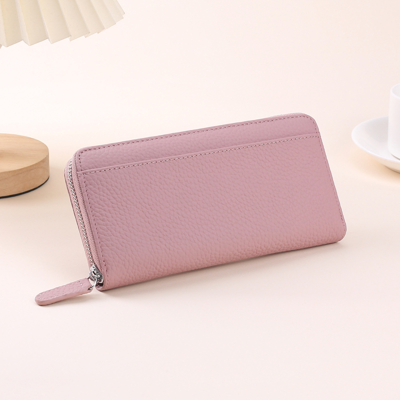 Naistele ehtne nahast pikk klutch-kott, tõmblukuga, vertikaalne ruudu kujuline siluett, kõrgekvaliteediline veiseloha nahk, tõmblukuga suletav, sisemised taskud telefonile ja dokumentidele