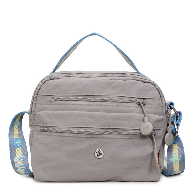 Nylonová crossbody taška so zipsom, horizontálny štvorcový tvar, priečinok na dokumenty, polyesterová podšívka, zimné vydanie 2025