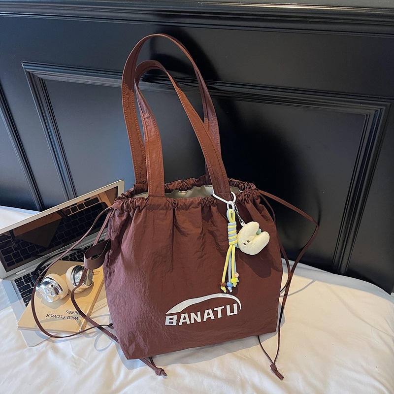 Ľahká nylonová tote taška so sťahovacím otvorom, vnútorná kapsa na telefón, Jeseň 2025