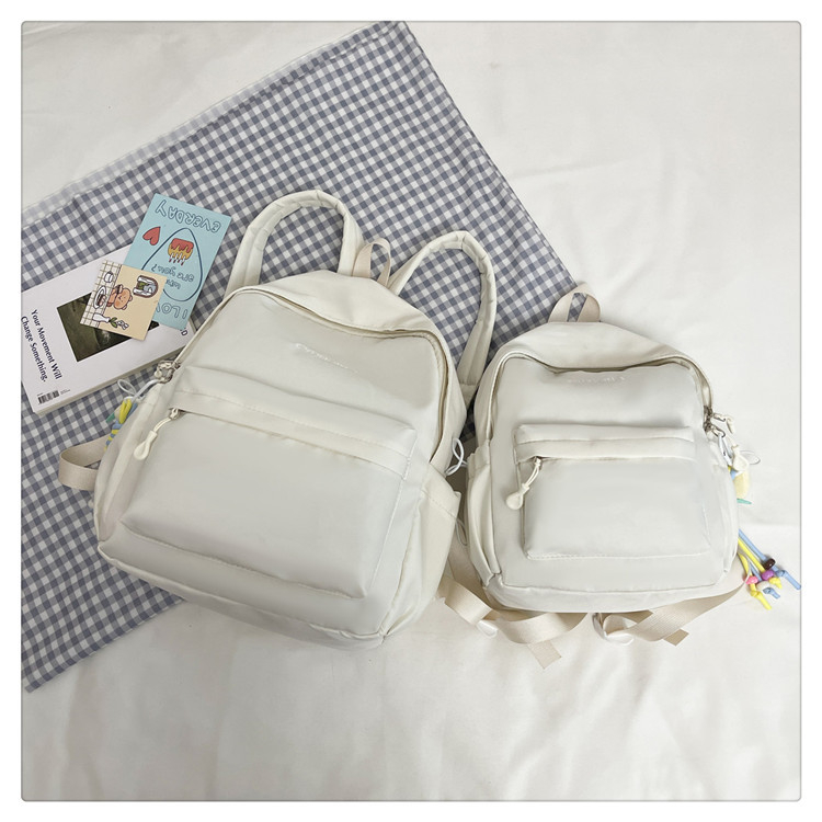 Női nylon hátizsák, városi minimalista stílusban (13 hüvelykes laptop kompatibilis, kapacitás 20 L alatt, görbült vállpántok)