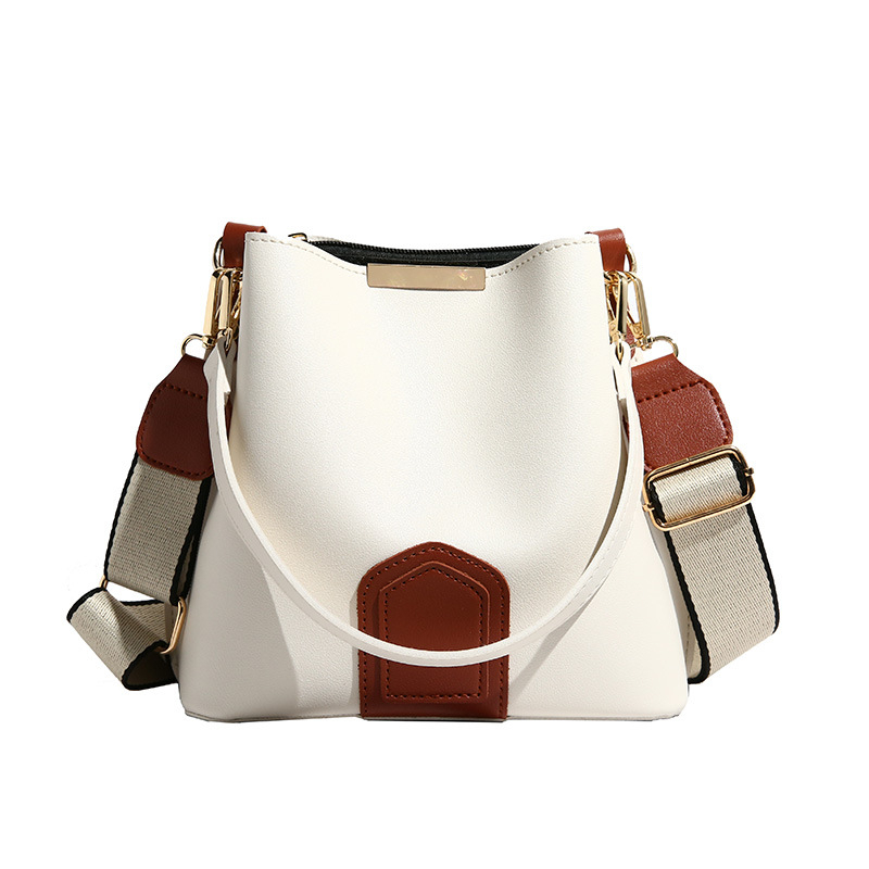 Bucket taška — PU materiál, oválny tvar, magnetické zapínanie, vnútorné vrecká so zipsom, vrecko na telefón, vrecko na ID, jar 2025