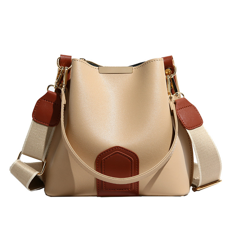 Bucket taška — PU materiál, oválny tvar, magnetické zapínanie, vnútorné vrecká so zipsom, vrecko na telefón, vrecko na ID, jar 2025