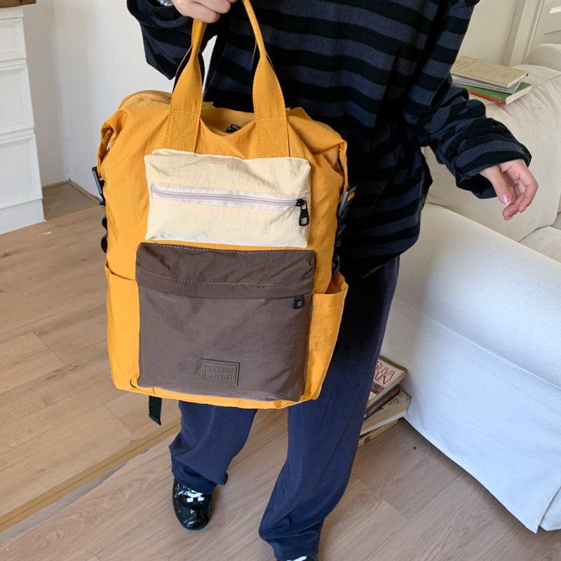 Unisex lagani ruksak s dizajnom color-block za svakodnevnu upotrebu i putovanja, kapacitet 20–35 L, kompatibilan s 13-inčnim prijenosnikom, model 2025