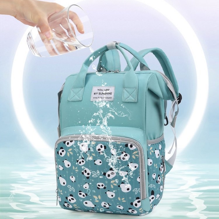 Rucsac maternitate, capacitate mare, compartimente multiple, separare uscat/umed, material Oxford, căptușeală poliester, curele cu pernă de aer (Oxford material; separare uscat-umed; desene anime)