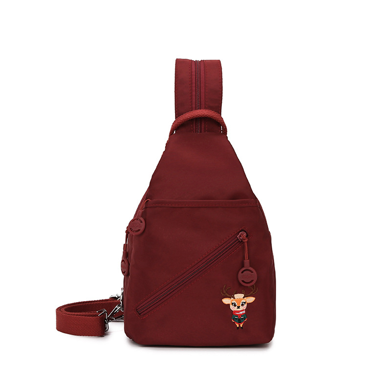 Crossbody torba, gradski stil, platnena materija, uspravni kvadratni oblik, zatvaranje na zip, skriveni džep sa zipom