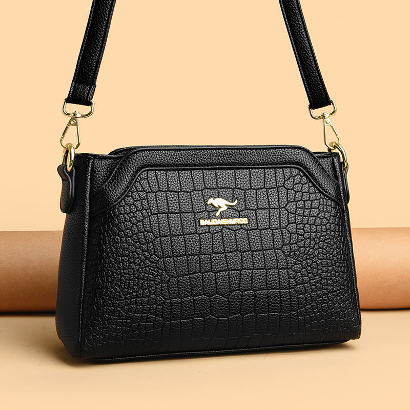 Ženska crossbody torbica — ugravirana vintage tekstura, PU materijal, zatvaranje na zip, horizontalni kvadratni oblik, široka naramenica
