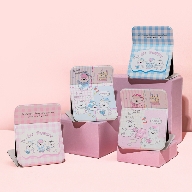 Összecsukható asztali sminktükör aranyos rajzolt kiskutyás dizájnnal (keret: PU/PS/PVC; lencse: üveg; testreszabás elérhető; logó nyomtatás lehetséges; ideális ajándék, esküvők, születésnapok vagy költöztetés esetén)