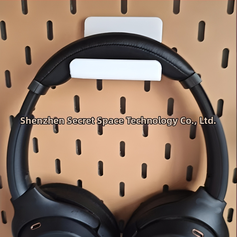 Perforētās plāksnes piederumi: roktura turētājs, universālais austiņu statīvs, sienas organizētājs bez urbšanas, plastmasa