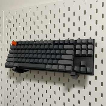 Skadis universālais mehāniskais tastatūras turētājs perforētajam panelim