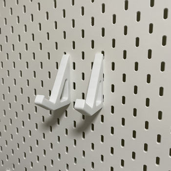 Skadis universālais mehāniskais tastatūras turētājs perforētajam panelim