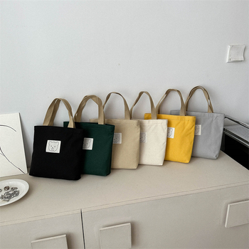 Sminktáska vászonból, függőleges négyzet alakú, cipzáras zárás, dupla fogantyúval