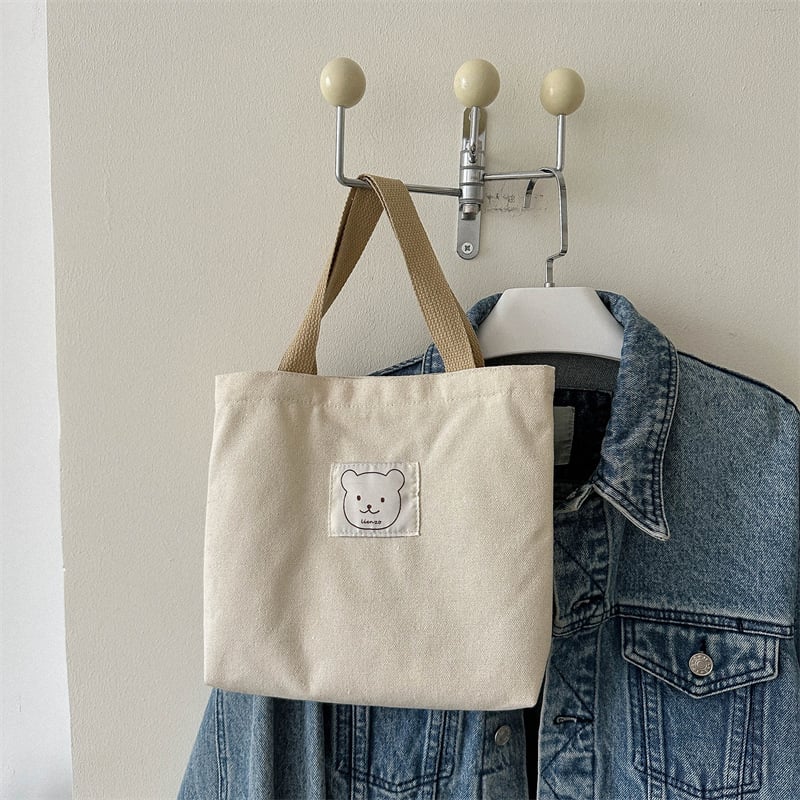 Sminktáska vászonból, függőleges négyzet alakú, cipzáras zárás, dupla fogantyúval