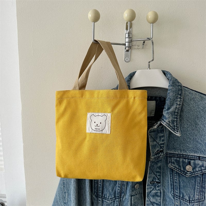 Sminktáska vászonból, függőleges négyzet alakú, cipzáras zárás, dupla fogantyúval