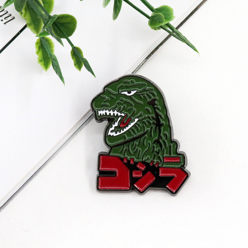 Broš – Personalizirana životinjska karikatura dinosaura Godzilla; materijal: legura; završna obrada: bojena; funkcija: ukrašavanje; unisex; izdanje: zima 2024