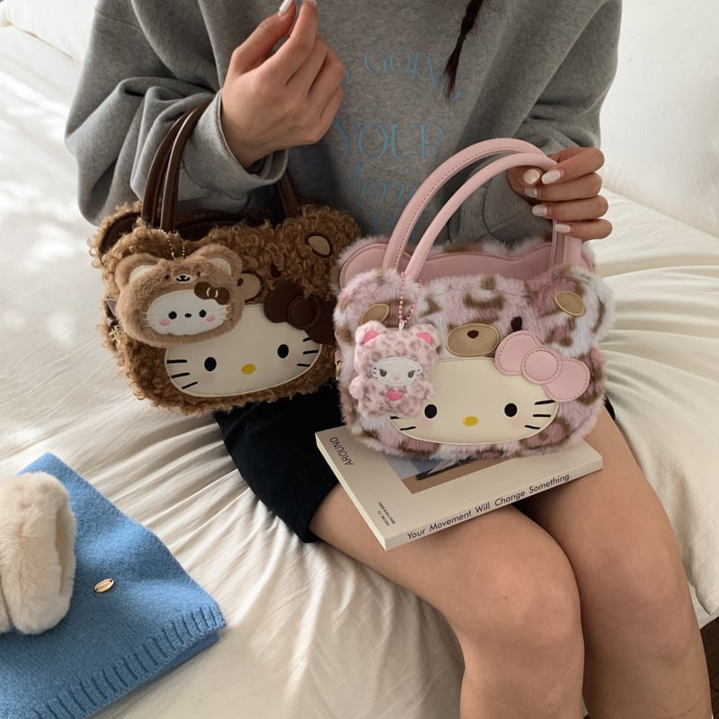 Gyerekeknek szánt rajzfilmszerű oldaltáska macska motívummal (Nylon; kerek forma; cipzáras záródás; belső cipzáros rekesz; egyoldali vállpánt)