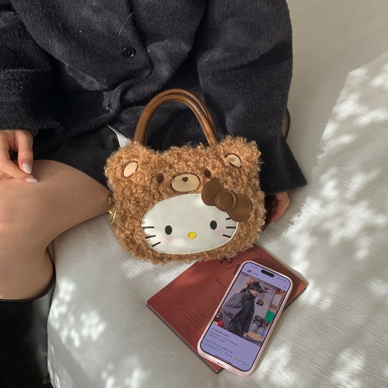 Gyerekeknek szánt rajzfilmszerű oldaltáska macska motívummal (Nylon; kerek forma; cipzáras záródás; belső cipzáros rekesz; egyoldali vállpánt)