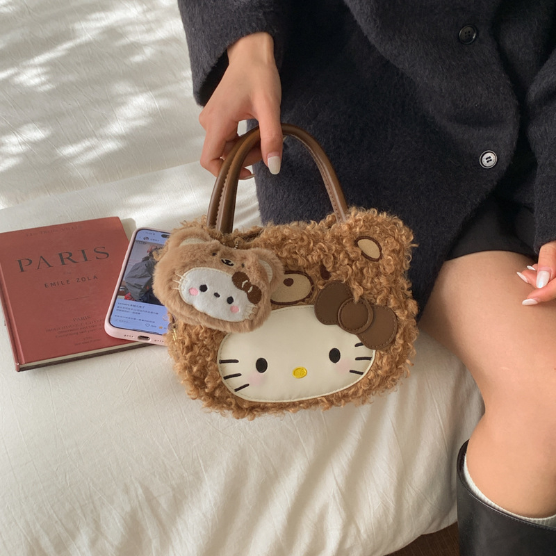 Gyerekeknek szánt rajzfilmszerű oldaltáska macska motívummal (Nylon; kerek forma; cipzáras záródás; belső cipzáros rekesz; egyoldali vállpánt)