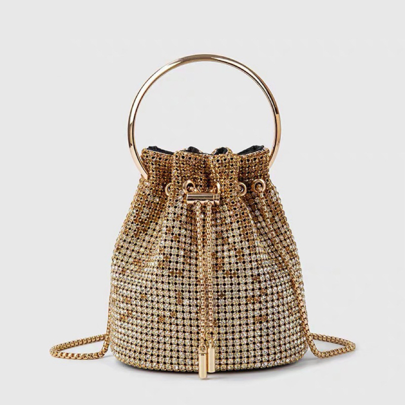 Rhinestone bucket torba – cilindrični oblik, otvaranje šniranjem, najlonska podstava, gradski stil