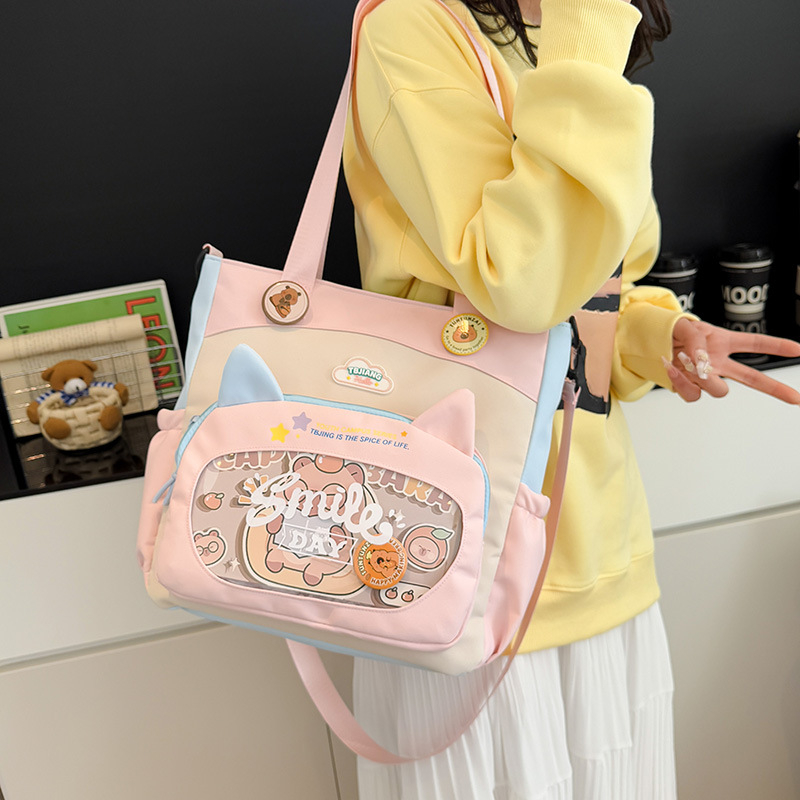 Nylonból készült crossbody táska lányoknak iskolai használatra, rajzfilm-stílus, kopásálló, csökkenti a terhelést, tárolható, poliészter bélés