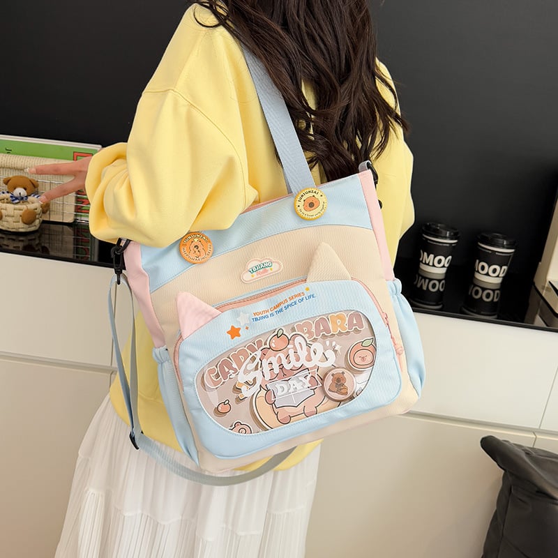 Nylonból készült crossbody táska lányoknak iskolai használatra, rajzfilm-stílus, kopásálló, csökkenti a terhelést, tárolható, poliészter bélés