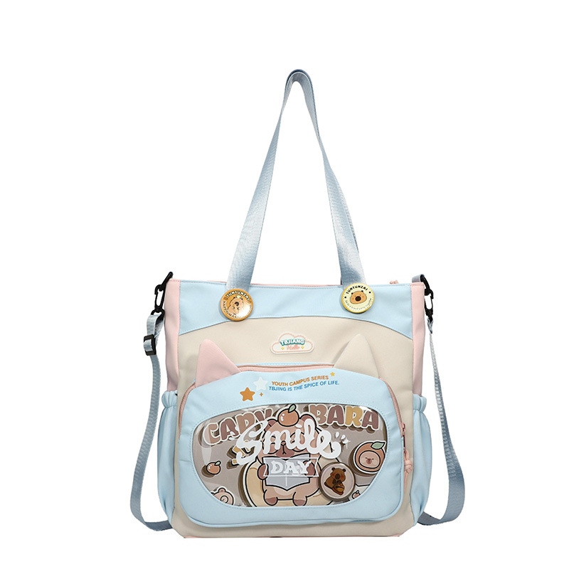 Nylonból készült crossbody táska lányoknak iskolai használatra, rajzfilm-stílus, kopásálló, csökkenti a terhelést, tárolható, poliészter bélés