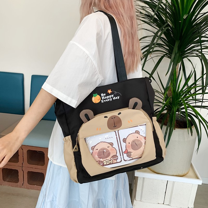 Capybara Oxford anyagból készült vízálló oldaltáska általános iskolás lányoknak, állatmintás, poliészter bélés, ősz 2025